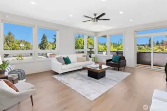 Upper-level living room opens to patio—soaked in natural light.