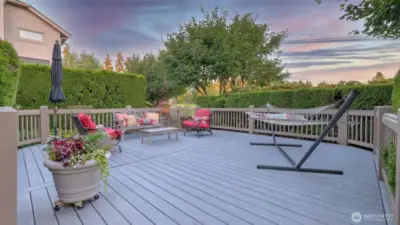 Lush landscaping surrounds the deck for added privacy