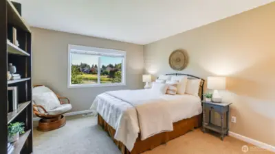 Second of three bedrooms upstairs sporting gorgeous views of the course