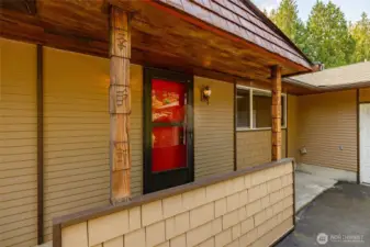 The front entry with newer screen door for ventilation on hot days.