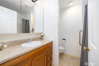 This is the hall bathroom. It is a full bathroom with shower/tub insert and tile floors. New lighting and exhaust fan.