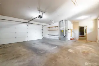 The garage is huge, and that is a brand new garage door opener, recently installed and adjusted. The gas furnace and hot water heater also just serviced.