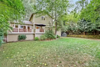 Nice big, fenced back yard with gates on each side of the house. More storage under the deck (see next pic).