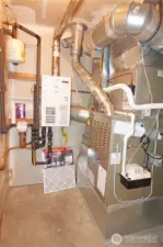 Mechanical room housing the furnace and on demand hot water tank.