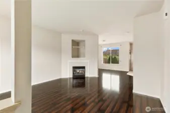 Open the front door to gleaming floors,  high ceilings and lots of light.  And an inviting gas fireplace to cozy up to in the winter.