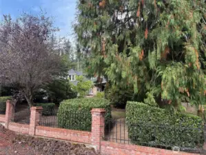 Beautiful brick and iron fence around the property.