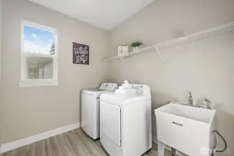 Laundry room with utility sink.