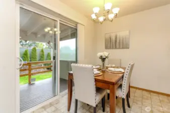 Formal dining area leads to covered patio