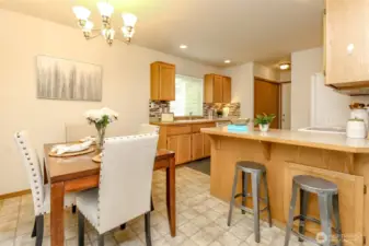 Open and spacious kitchen with oak cabinets