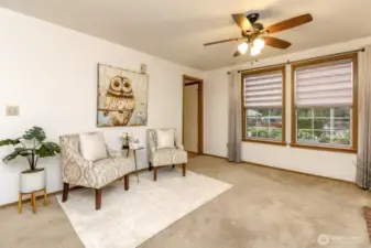 Family room just off the kitchen with windows facing the front yard.