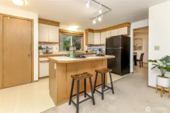 From this angle of the kitchen you can see the dining room / living room areas. The door in the picture is the pantry.