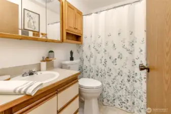 Full upstairs bath rom in hall at top of the stairs.