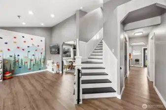 This home has been updated throughout- stunning black & white staircase with chair railing going upstairs. NEW 22mil Mohawk vinyl planking covers the entire downstairs.