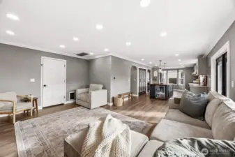 You'll be captivated by the generous family room with crown molding, new luxury vinyl floors, warm designer colors and modern touches.