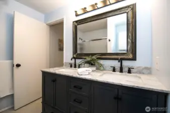 Full bathroom on upper level with dual sink vanity