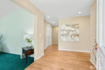 Hardwood floors greet you along with a step down into your formal living area with gas fireplace and bay windows bringing in the natural light.