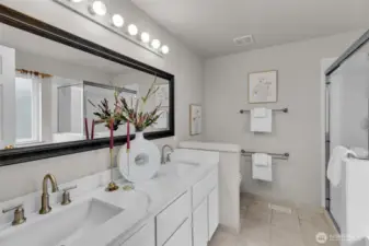 Quartz countertops, new sinks and faucets for this remodeled full bathroom.