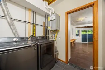 W/D and On Demand Hot Water located in finished basement.