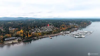 NEIGHBORHOOD VIEW FROM THE SKY | West Olympia features so much PNW beauty and this photo captures it perfectly. Just up the hill from West Bay Drive and the marina is the Crestline neighborhood where this home lives.