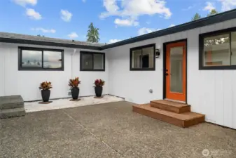 2ND FRONT ENTRANCE | This door accesses the wing of the home that features a primary bedroom, bathroom and sitting area. Perfect for making this a private multi-gen or rentable space.