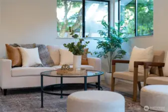 PERFECT PEACEFUL CORNER | Curl up in this corner of the family room with a cup of coffee and your laptop and pretend you're working while you get distracted by the surrounding beauty.