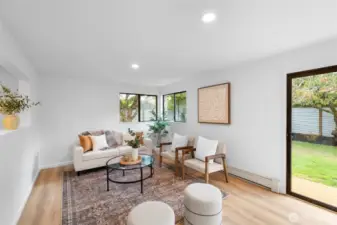 FAMILY ROOM | Located at the back of the home, this spacious family room is just off the kitchen and flows out the sliding glass door into the backyard.