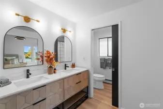 PRIMARY BEDROOM 2 BATHROOM | All new flooring, lighting, vanity and paint make this space so fresh and pleasing.