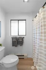 PRIMARY BEDROOM 2 BATHROOM | With a new fan, fresh paint and flooring, this bright little bathroom is perfect.