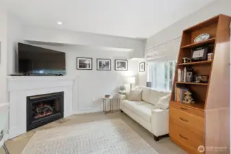 Studio with cozy electric fireplace.