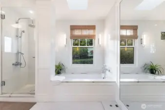 Primary Bathroom with soaking tub, Waterworks hardware, and outlets in cabinets for electric toothbushes
