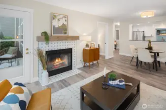 A wood-burning fireplace with reclaimed wood mantel and Moroccan tile creates an inviting focal point