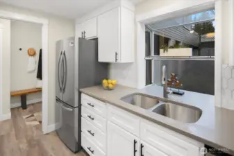 Newer cabinetry & lighting, custom tile work plus brand new fridge and range (Dec 2025).