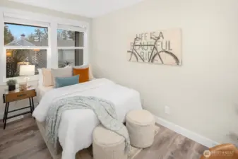 The guest bedroom includes its own custom closet system, ensuring comfort for your visiting friends and family.