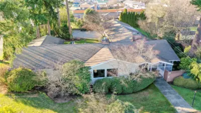 Situated on a private corner lot shy of ½ acre. Custom built in 1954 with rare features for its time, including a 3-car garage. Only two owners—thoughtfully preserved and enhanced. A true architectural legacy.
