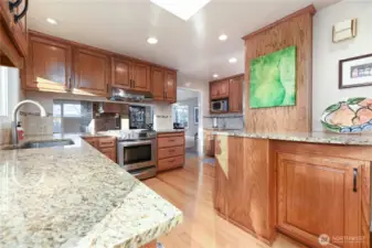 A truly unique kitchen designed for culinary creativity, featuring generous counter space, ample cabinetry, and abundant storage. This inspiring space has been the heart of catering for numerous parties, weddings, and fundraising events.