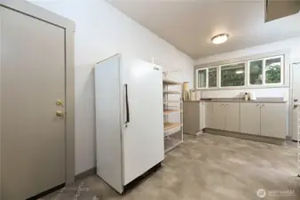 A finished bonus room off the wine room and garage offers exceptional flexibility. Designed for gift wrapping with a dedicated wrap drawer, it has also served as a workroom and canning storage—proof that every inch of this home was intentionally and thoughtfully planned.