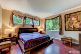 Leave the curtains open in your private primary suite!  Only thing you see outside your windows are trees.