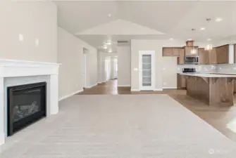 Convenient access from living space to kitchen and dining area is great for entertaining! Photo from same plan on different lot, finishes and features will vary.