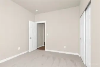 Spacious 3rd bedroom. Photo from same plan on different lot, finishes and features will vary.