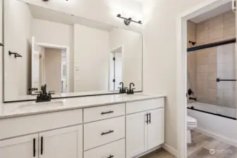 Elegant Guest bath with Dual Sink & Heavy Glass Shower Door