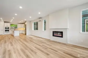 Spacious gathering area with fireplace surround