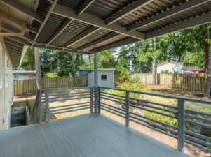 Large cedar deck is covered for year round enjoyment.