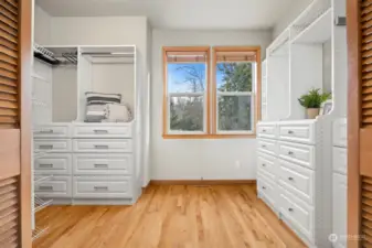 Extensive built ins in primary closet.