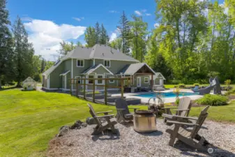 Fire pit set off patio area.  Parcel is beautifully landscaped.