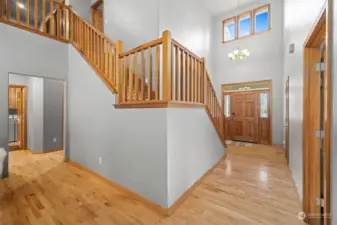 Two story entry is light and bright. Stunning wood staircase.