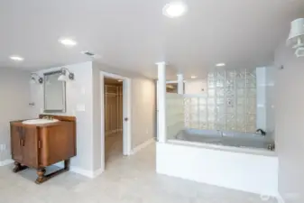 Basement full bathroom with walk-in closet