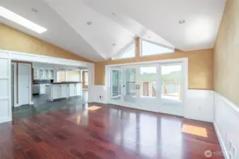 Beautiful architecture in the family room ceiling to focus the open view to the lake! Open concept and spacious living with doors from the family room and dining/nook to access the rear deck.