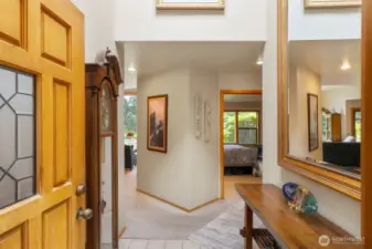 Entering the home.  Bedrooms to the right. Living, Dining, and Kitchen to the left.