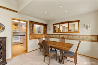 Dining room with custom wood worked pass through window