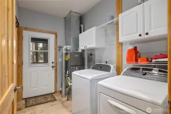 Utility room on the main level doubles as a separate entrance to drop snowy boots and jackets.
